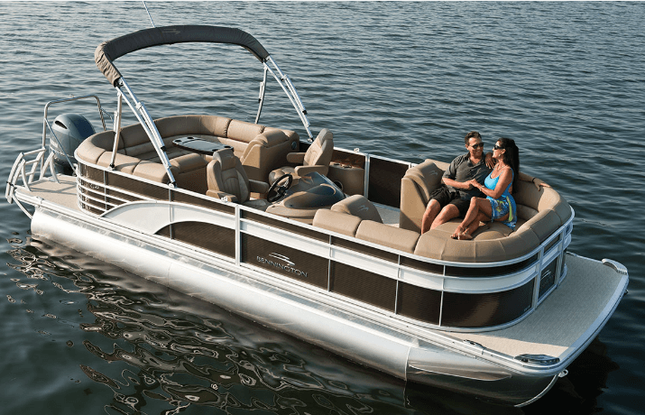 Leisurely pontoon boating on clear water with passengers lounging
