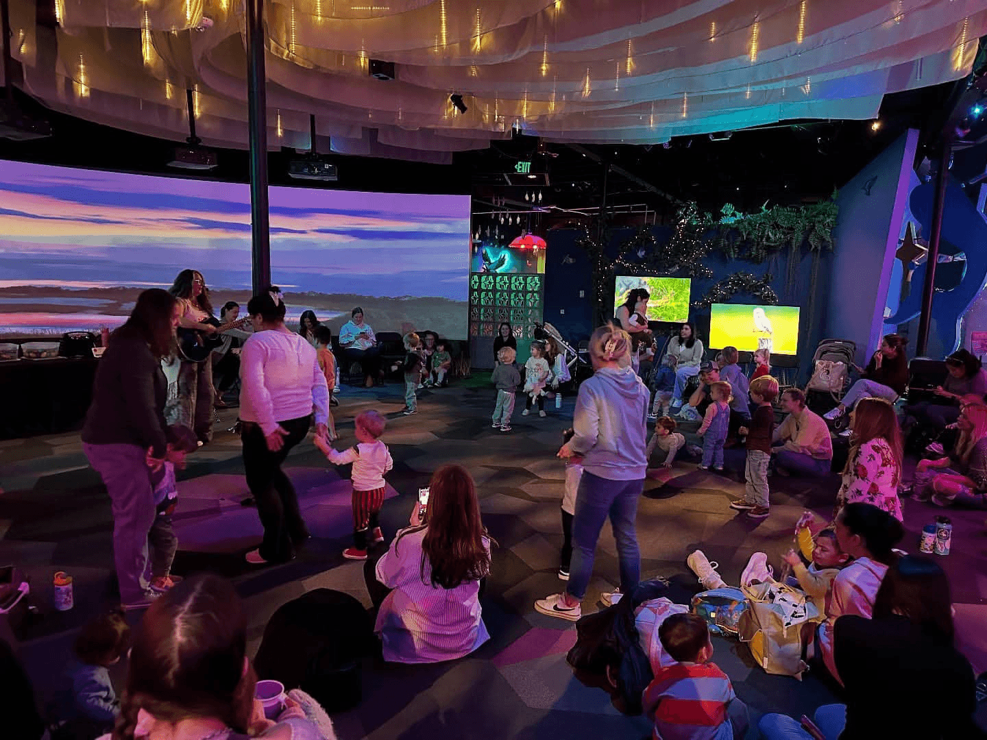 Families enjoying indoor immersive art space at Floridarama
