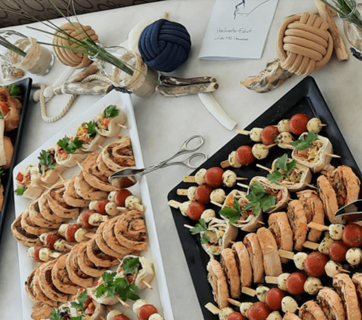 Catered appetizer platters for boat event, indoor buffet setup