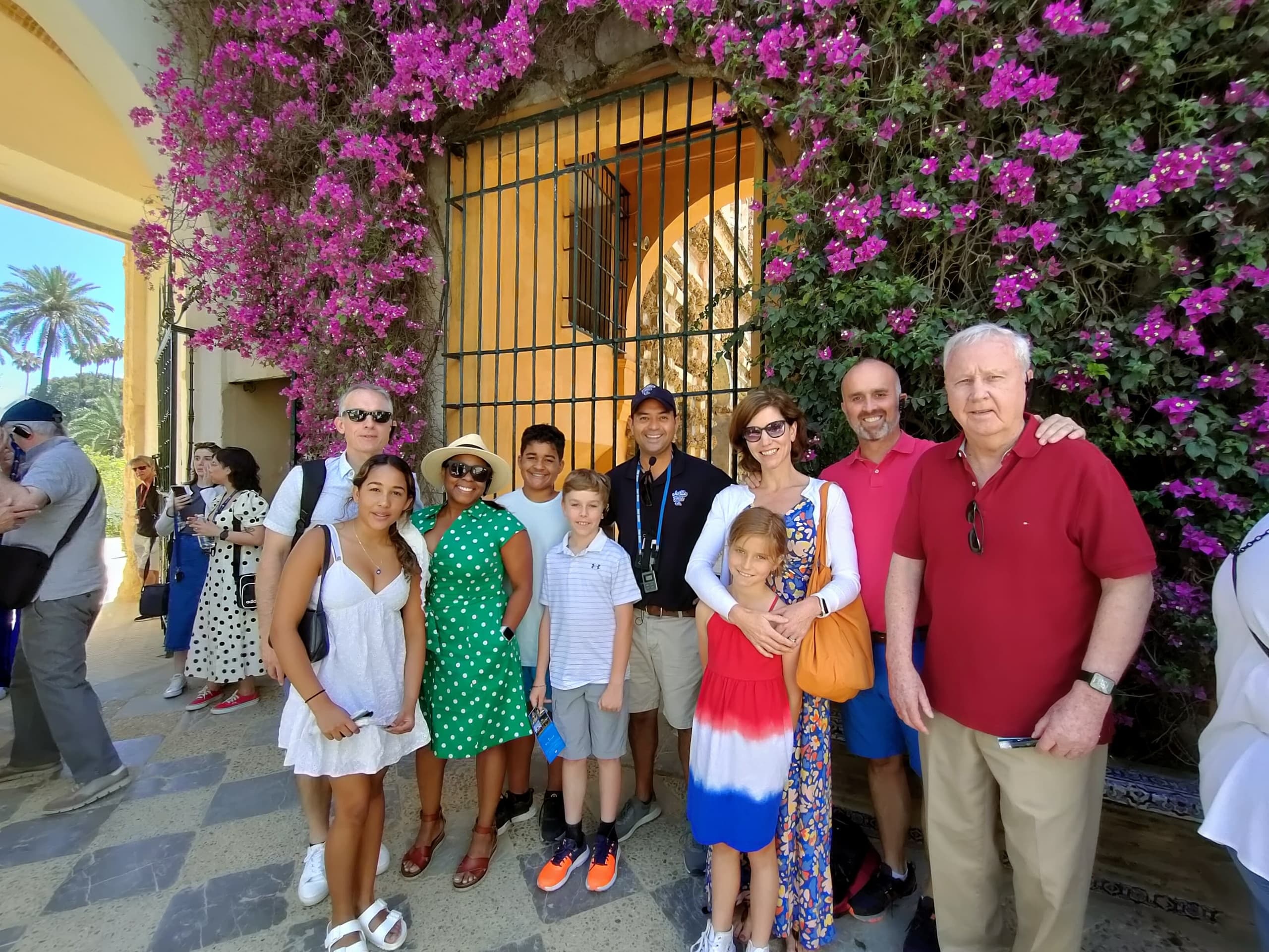 Outdoor Seville walking tour group by bougainvillea courtyard