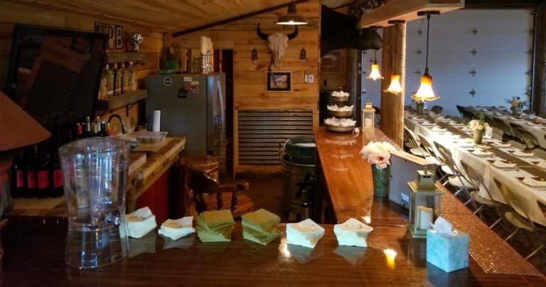 Cozy wooden bar counter and seating inside mountain lodge
