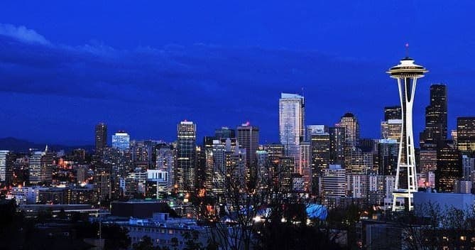 Seattle skyline view with Space Needle at dusk over Elliott Bay