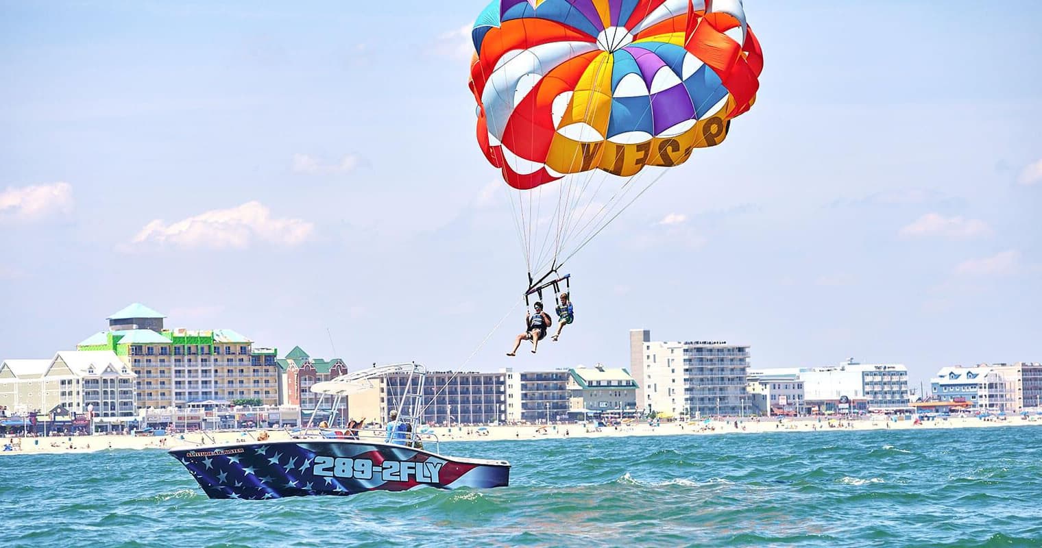 Tandem parasail over Ocean City coastline, aerial thrill