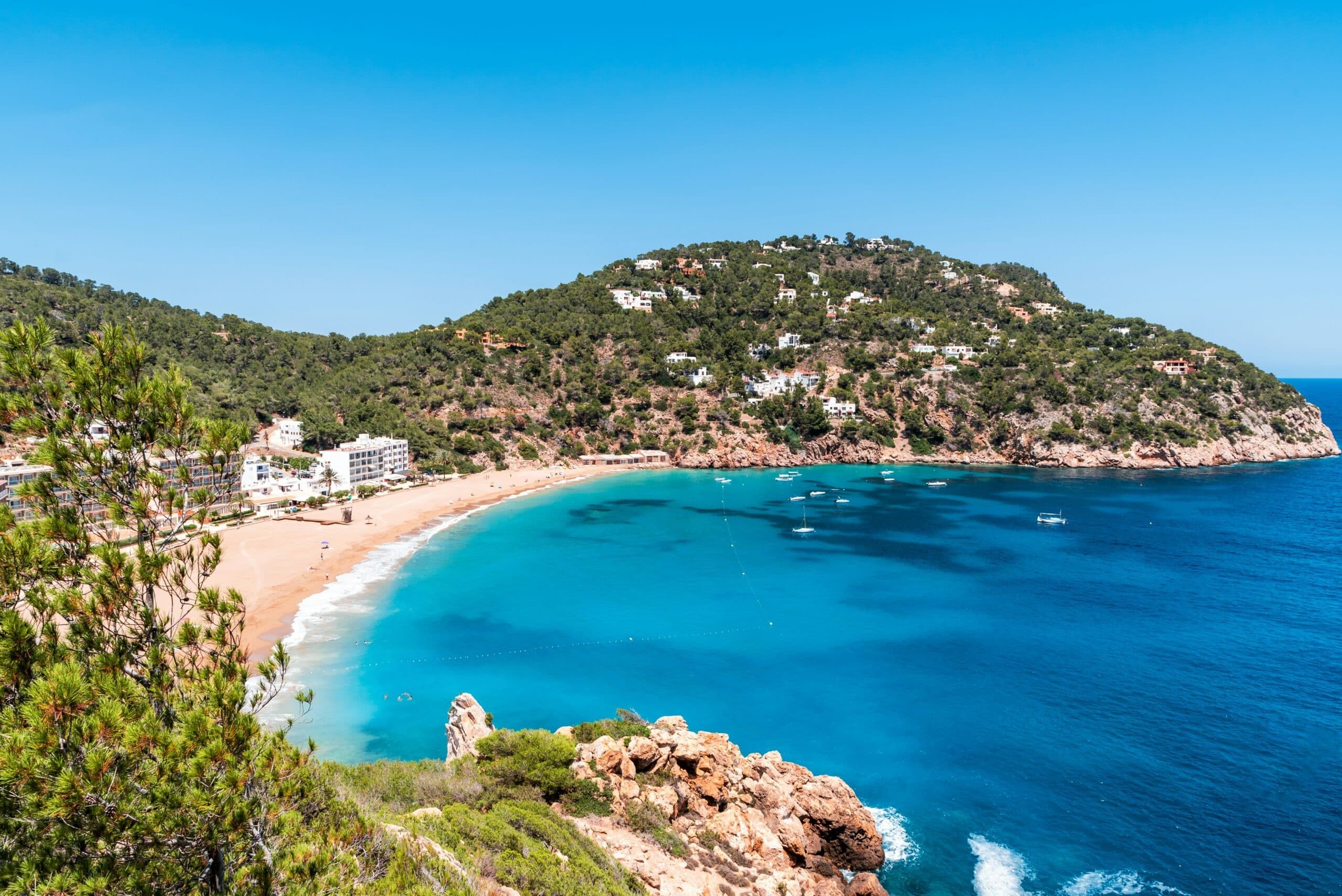Scenic turquoise bay and sandy beach on Ibiza coast