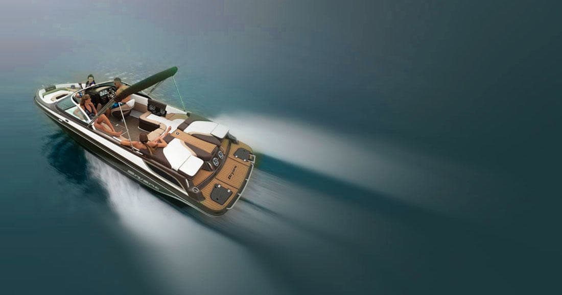 High-speed motorboat cruising over open lake at sunset