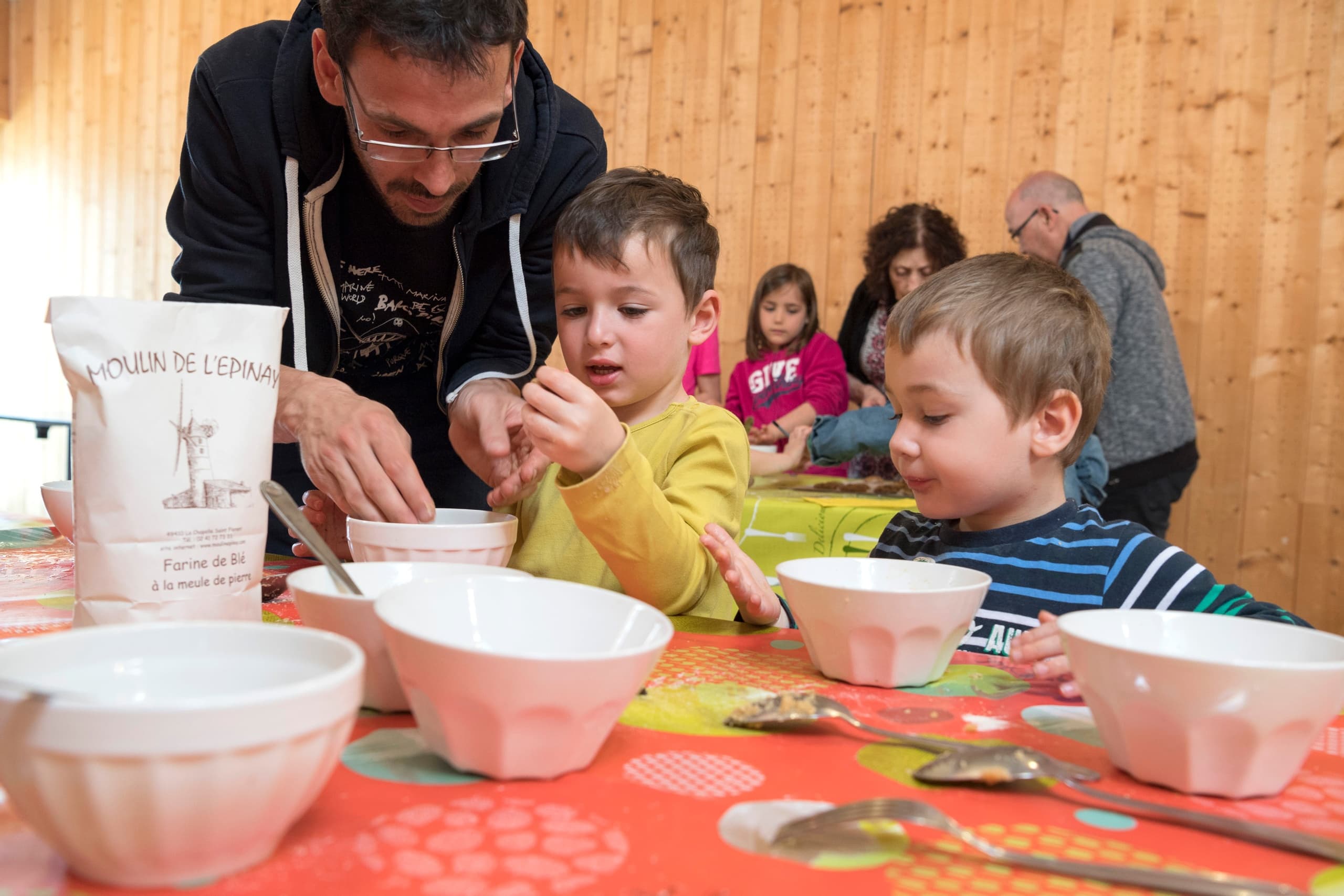 Children doing hands-on flour workshop at historic mill