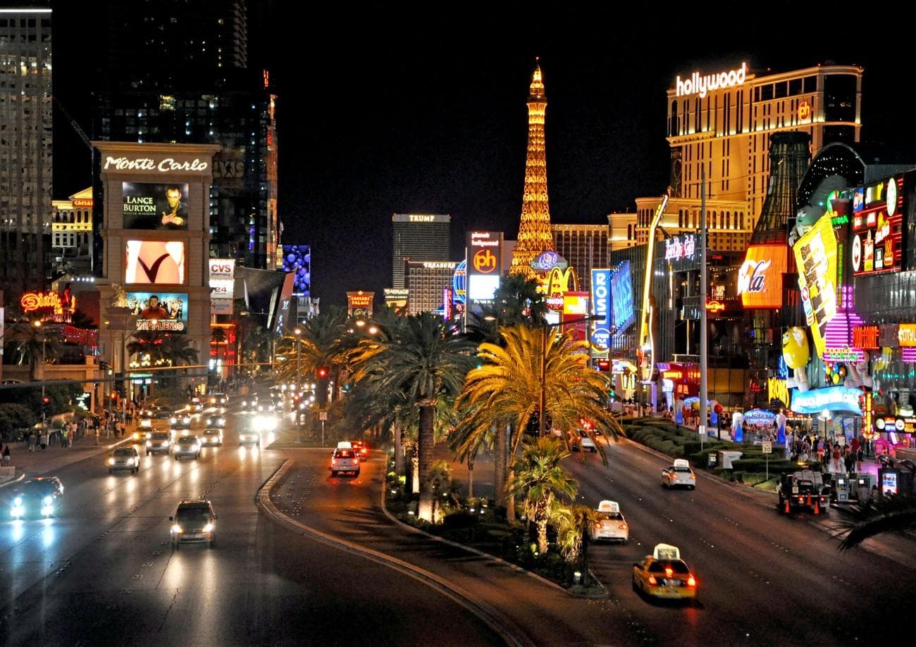 Busy Las Vegas Strip night traffic with illuminated hotels