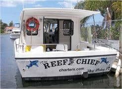 Sportfishing charter boat docked on coastal canal in Florida