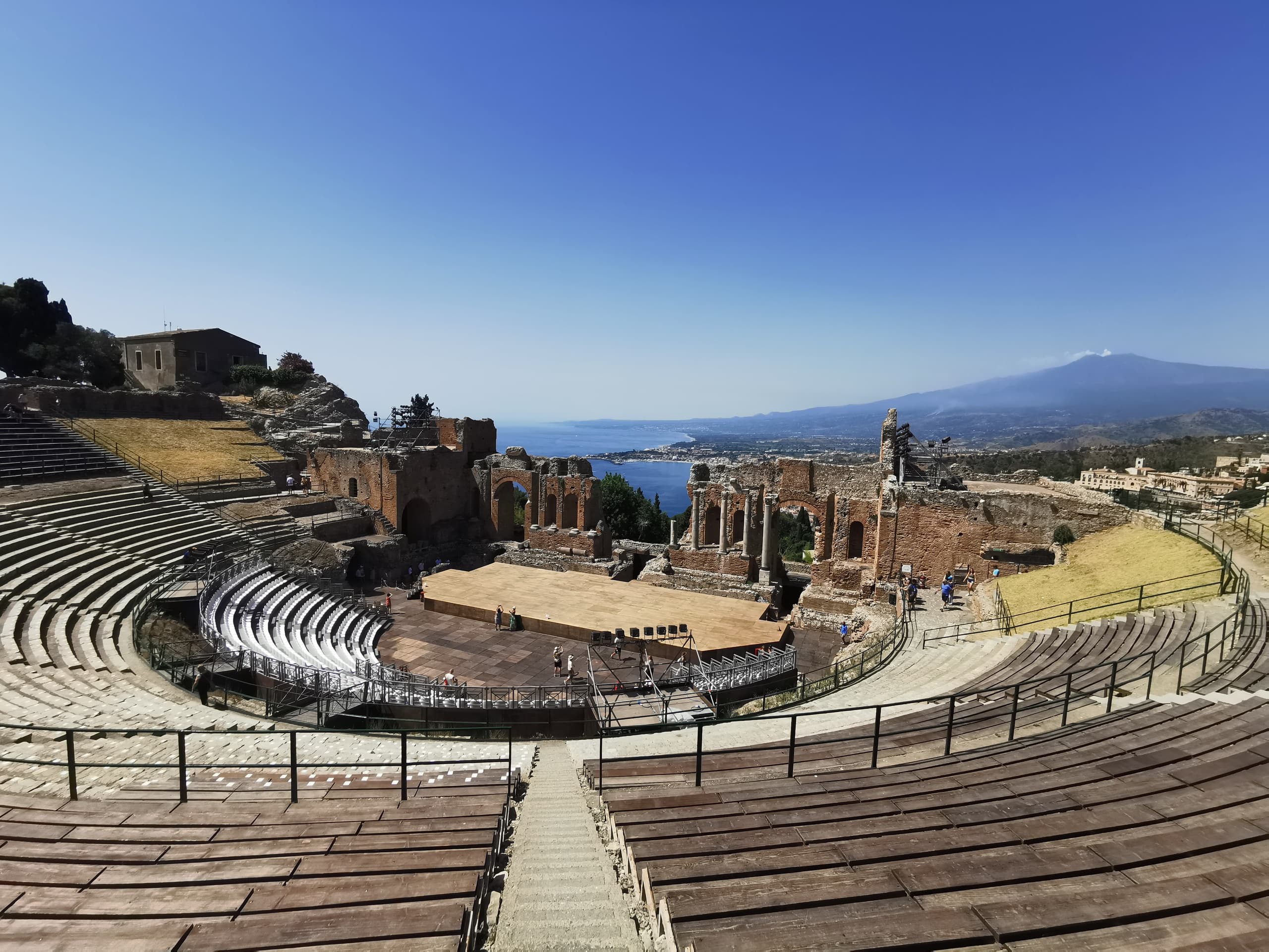 Ancient Greco-Roman theatre at Taormina with sea and mountain views