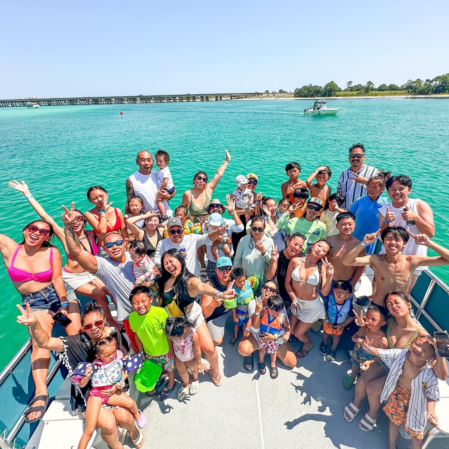 Large group on boat in turquoise bay enjoying snorkeling trip