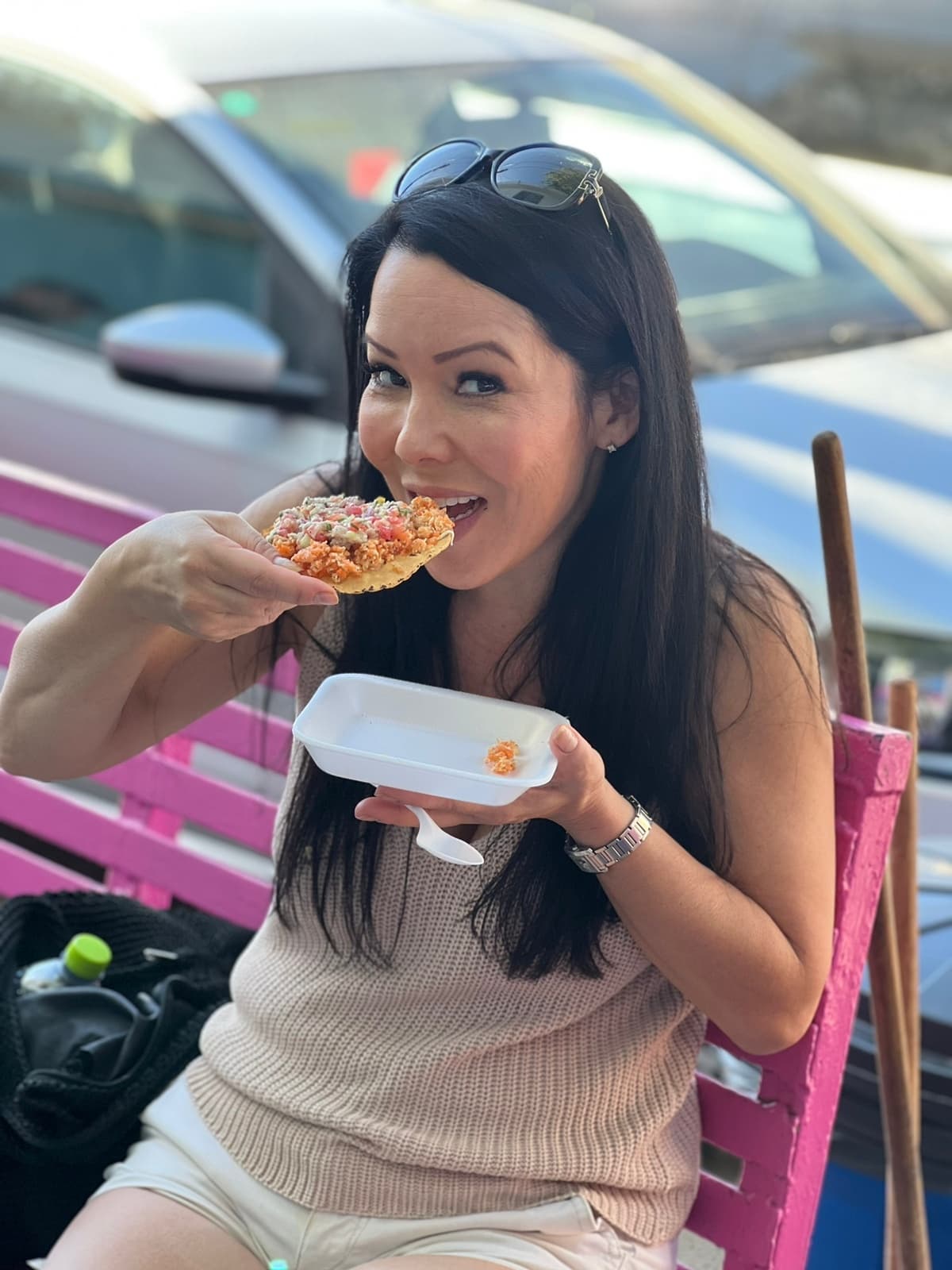 Traveler eating taco at outdoor seaside seating in Vallarta
