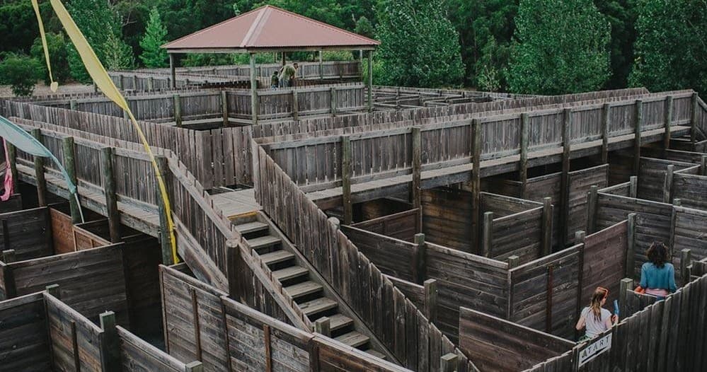 Aerial wooden maze with elevated walkway and viewing deck