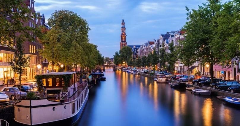 Explore Amsterdam’s Historic Canals Aboard a Private Deluxe Boat Cruise