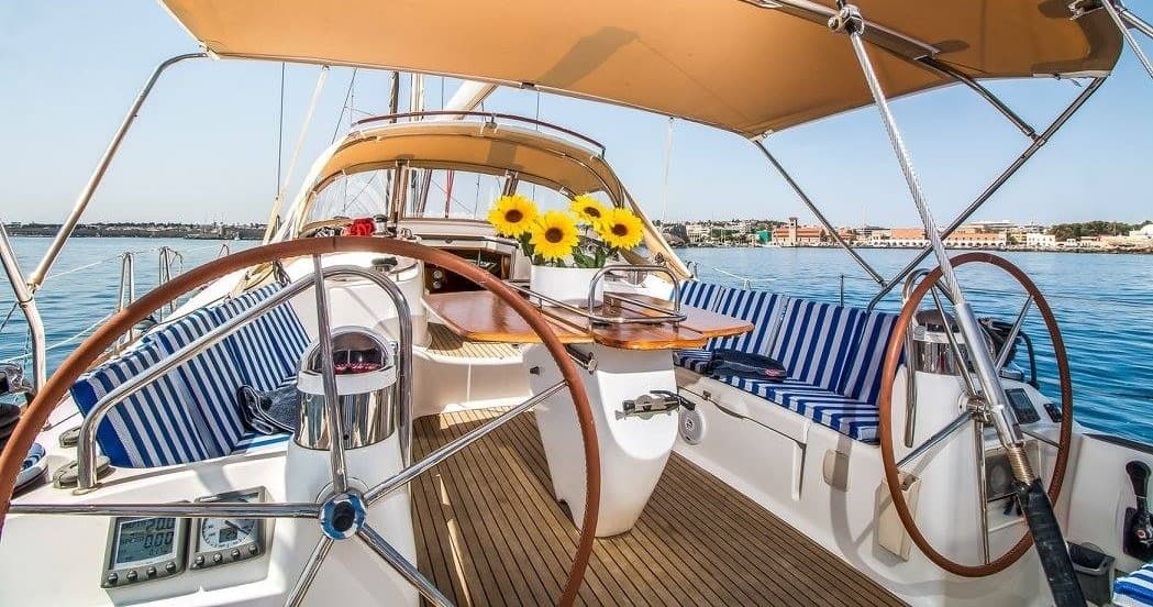 Sailing yacht cockpit and helm during coastal day cruise