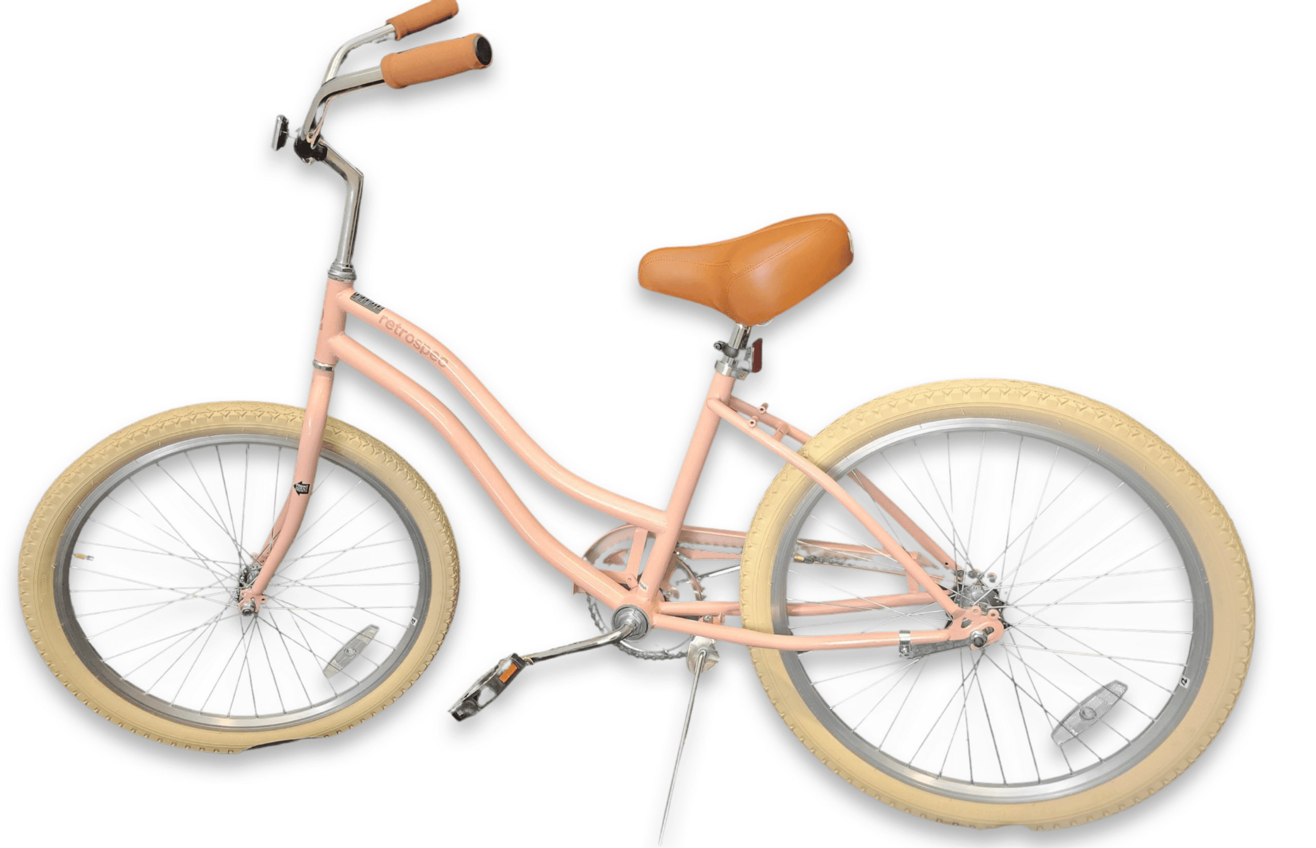 Pastel pink beach cruiser bicycle with tan tires on studio white