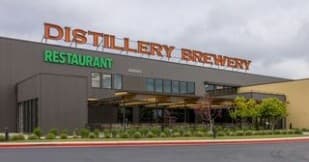 Distillery brewery exterior on suburban street, tasting venue