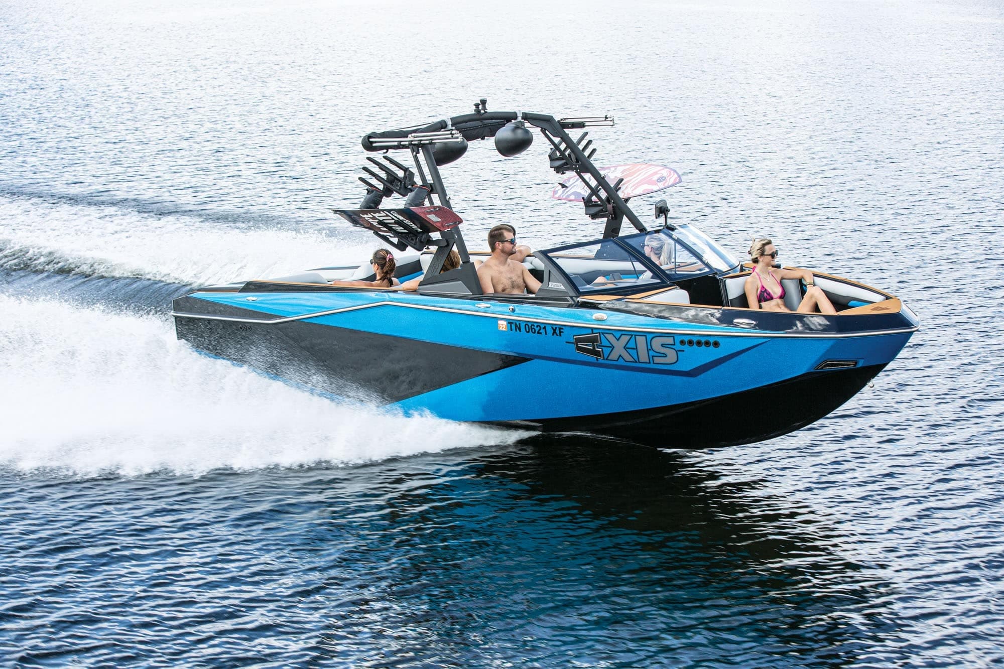 Speedboat wakeboarding charter cruising on open coastal waters
