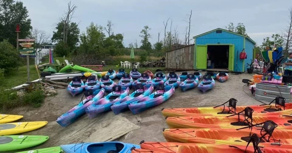 Colorful kayaks and rentals arranged at Portage River launch