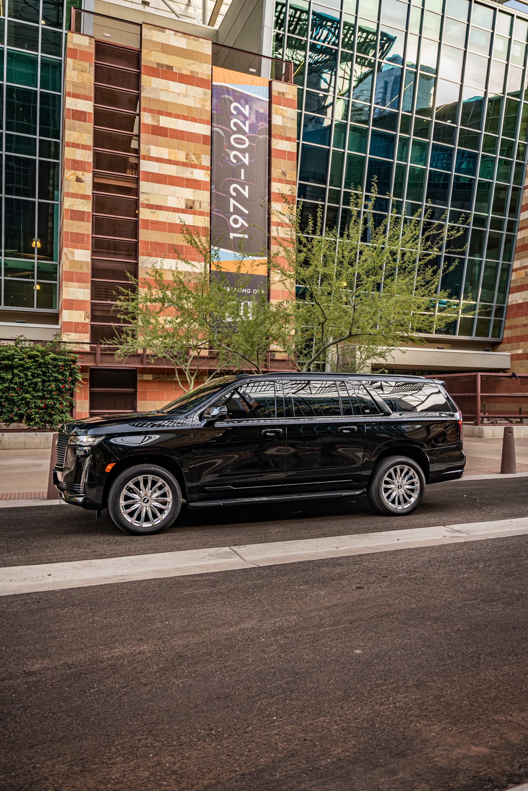Black SUV parked outside urban building near Salt River area