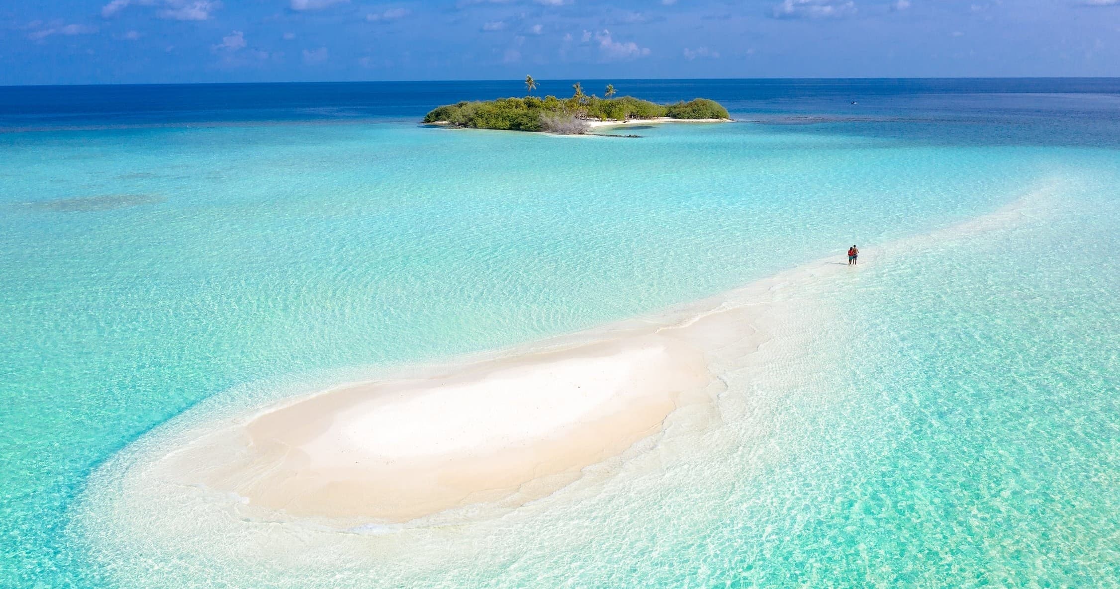 Walking on turquoise sandbar near tropical Key West island
