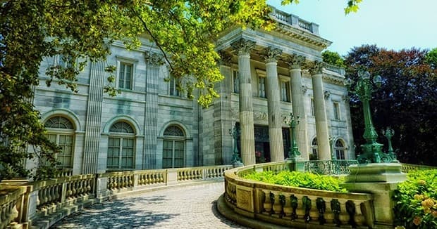 Historic Newport mansion exterior with landscaped terrace