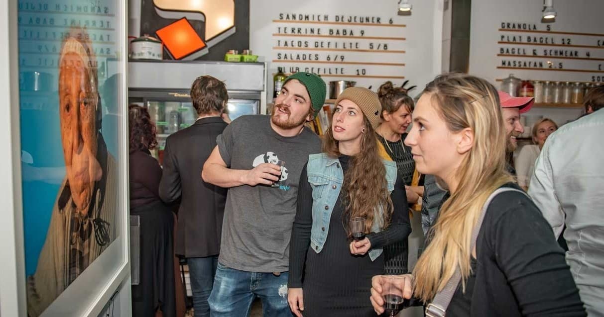 Visitors viewing contemporary art at indoor Montreal museum opening
