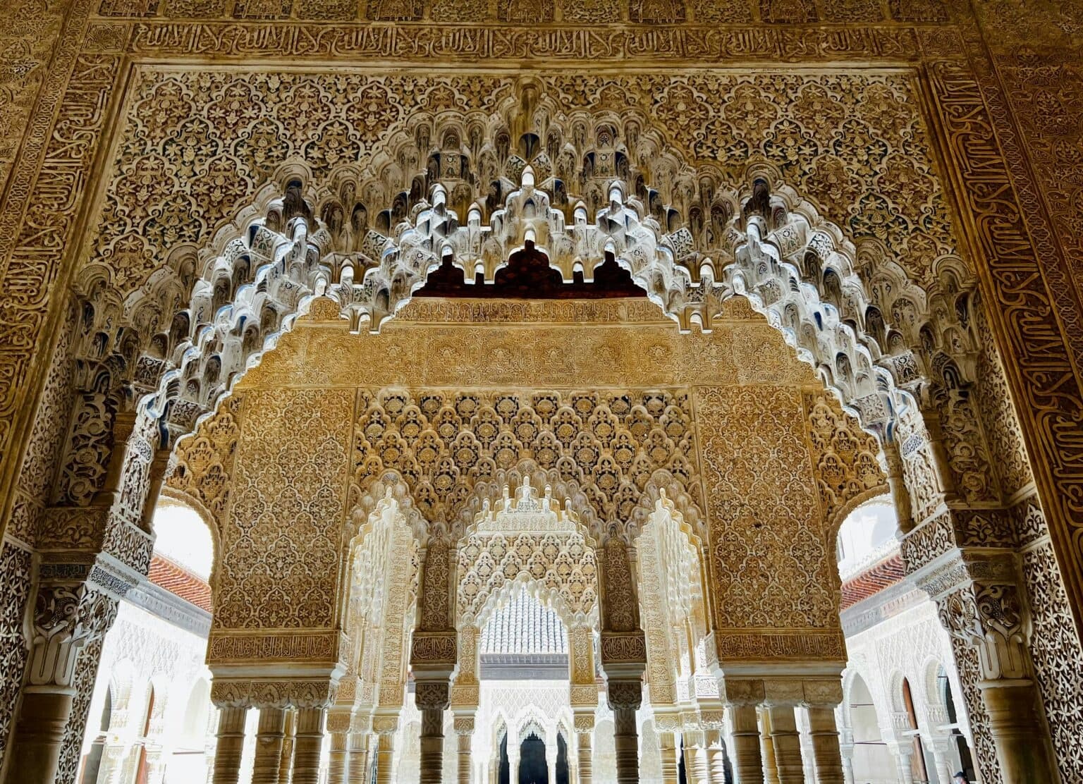 Exploring intricate Moorish interior arches in the Alhambra
