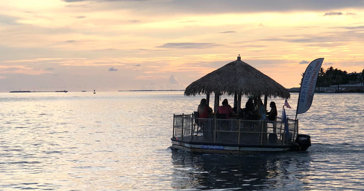 Evening sunset boat tour with thatched roof in Florida Keys
