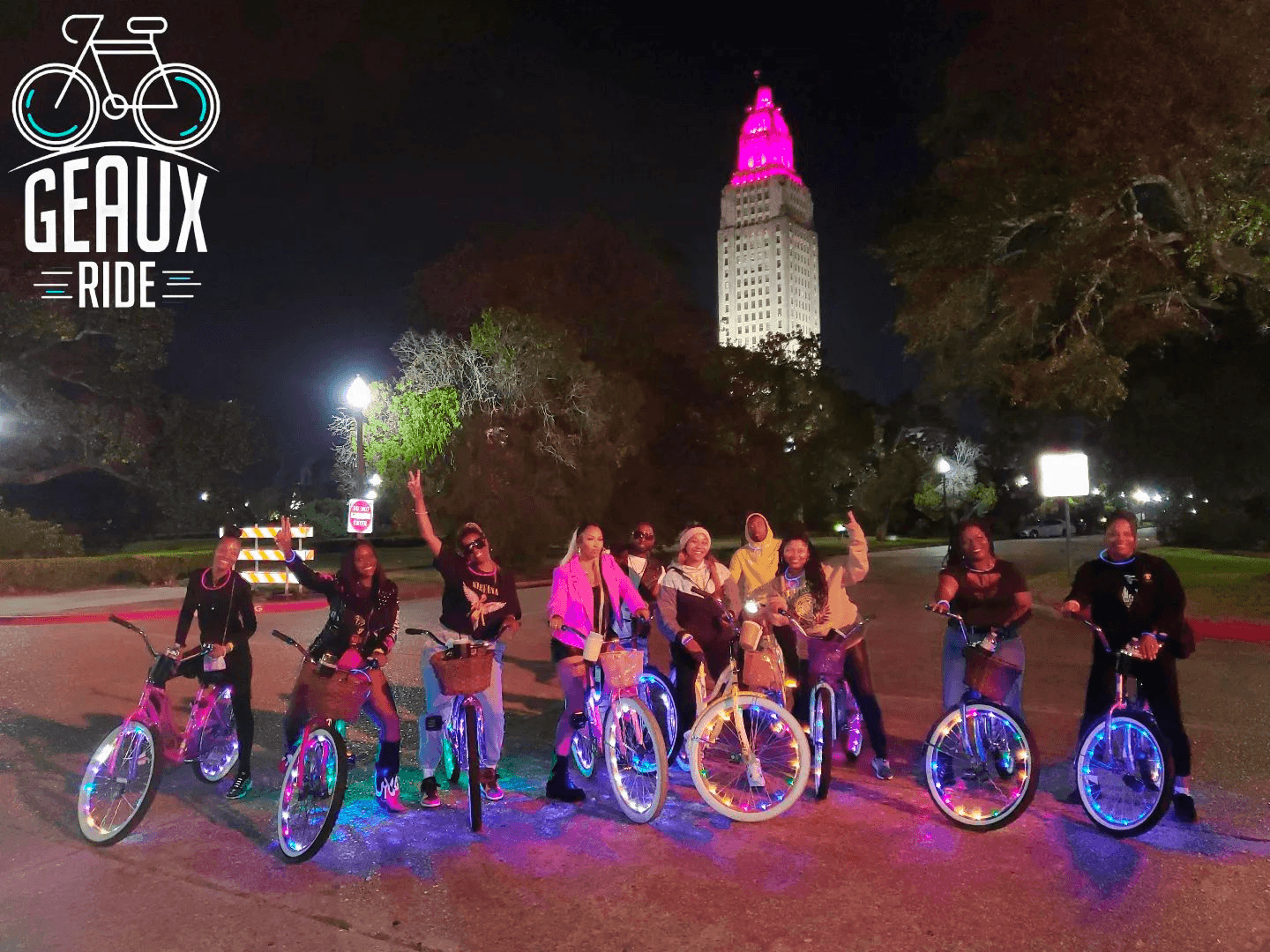 Night city bike ride with illuminated state tower skyline