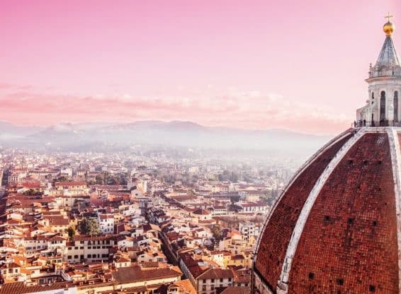 Florence skyline with Duomo dome and cityscape at sunset