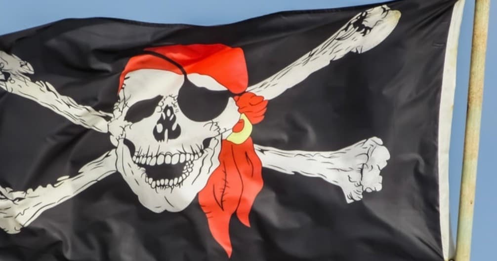Black pirate flag skull and crossbones on outdoor mast