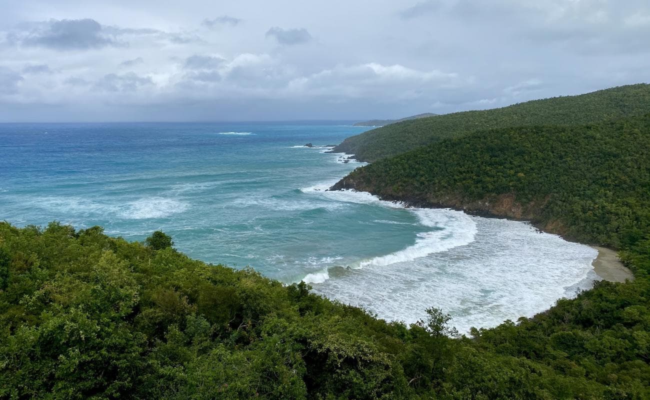 Rugged coastline with crashing waves, scenic ocean viewpoint