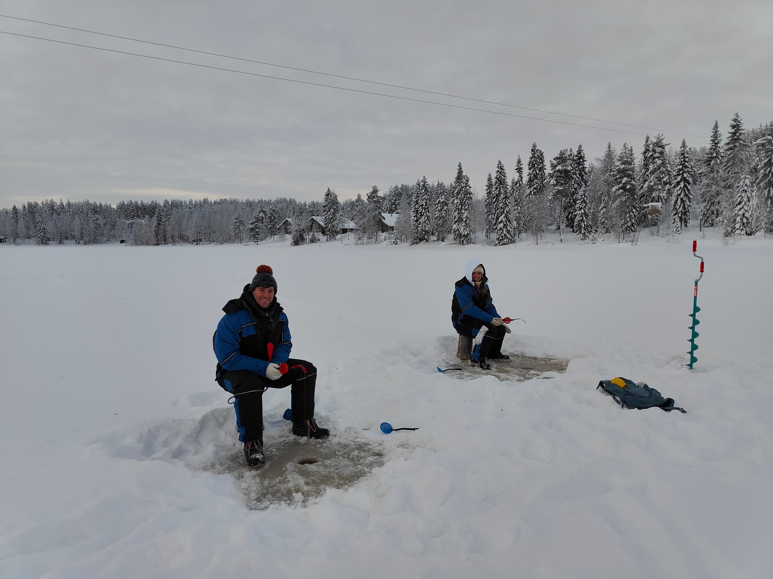 Guided Ice Fishing on a Frozen Lake at Ukkohalla, Hyrynsalmi