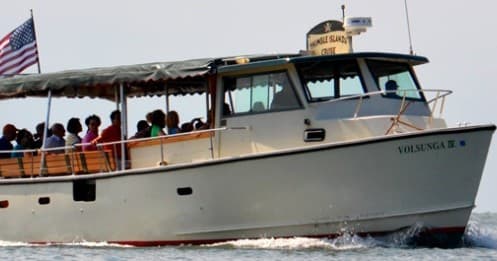 Sightseeing boat cruising coastal waters with passengers