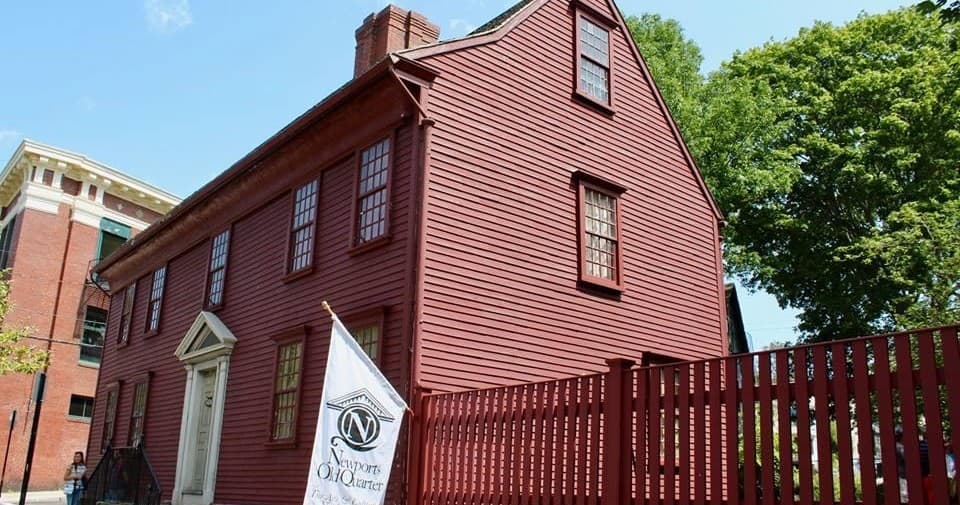 Historic red colonial house exterior on Newport walking tour