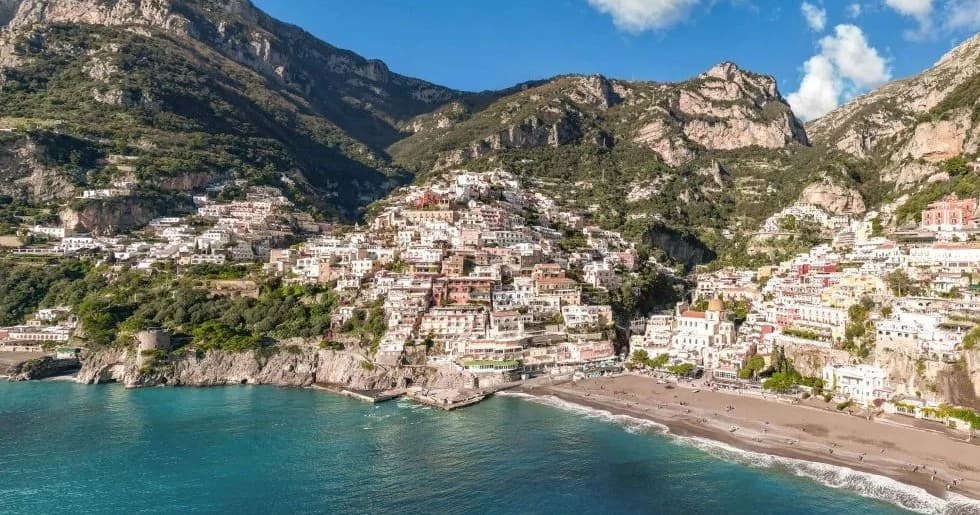 Picturesque coastal village and beach along rugged Mediterranean coast