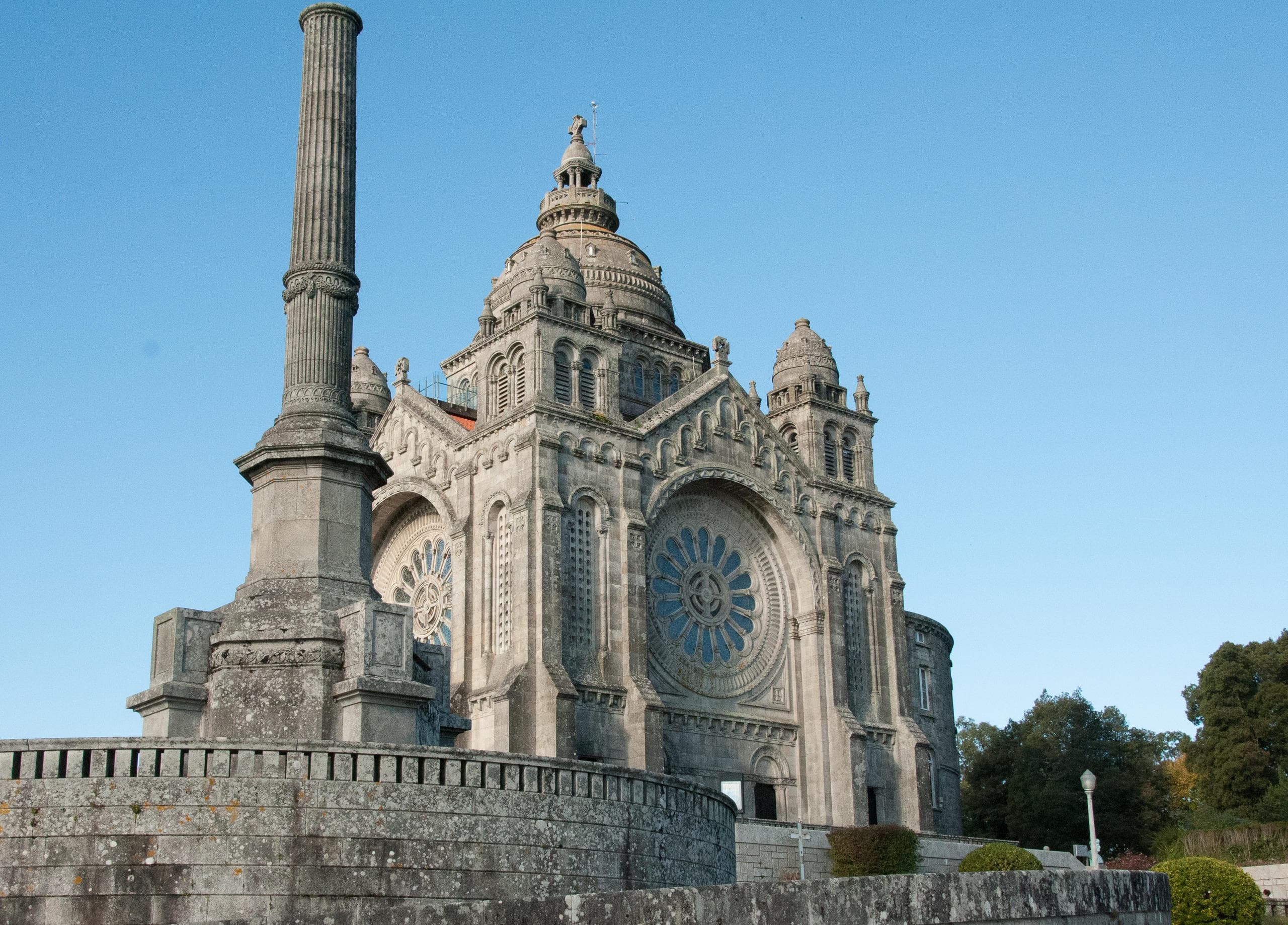 Monumental basilica and classical facades under bright blue sky