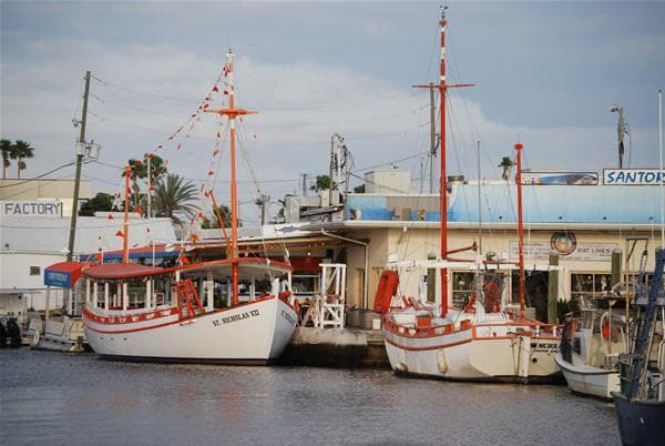 Historic sponge boats docked at Tarpon Springs waterfront marina