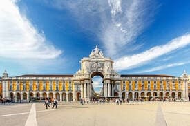 Historic city square with triumphal arch under blue sky, Lisbon