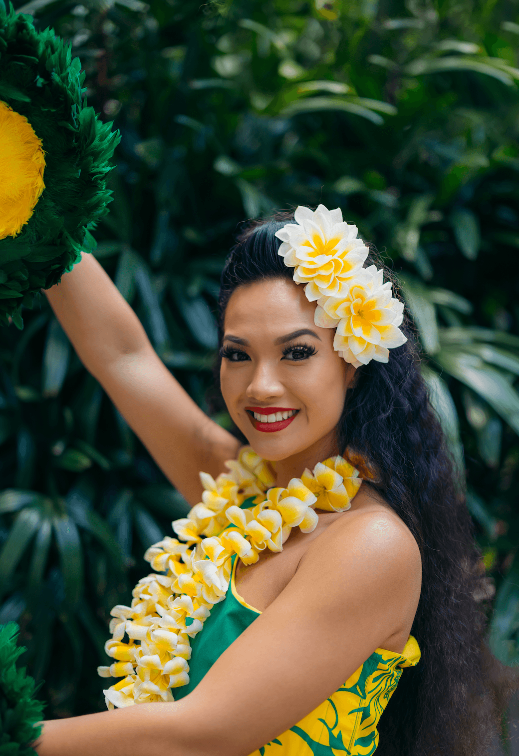 Portrait of woman hula dancer with lei at outdoor luau