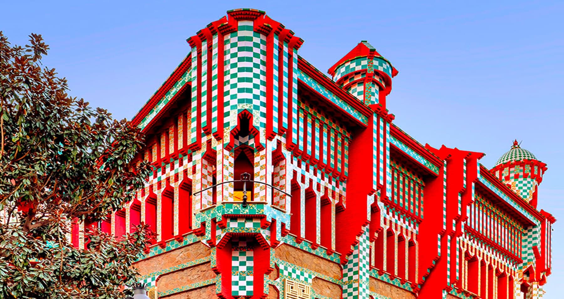Vibrant red modernist building exterior in Barcelona urban landscape