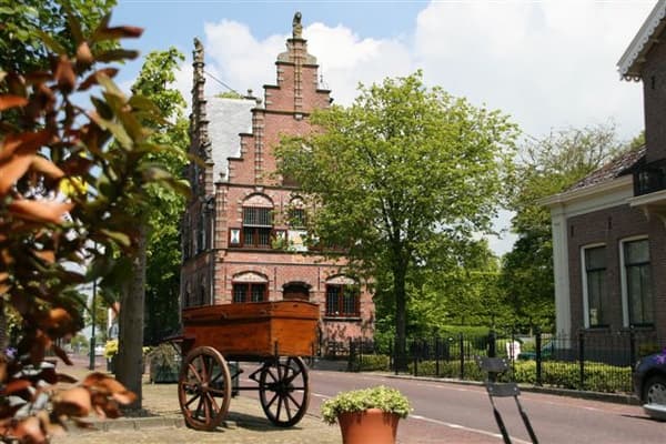 Scenic Dutch village street with antique cart for outdoor exploration
