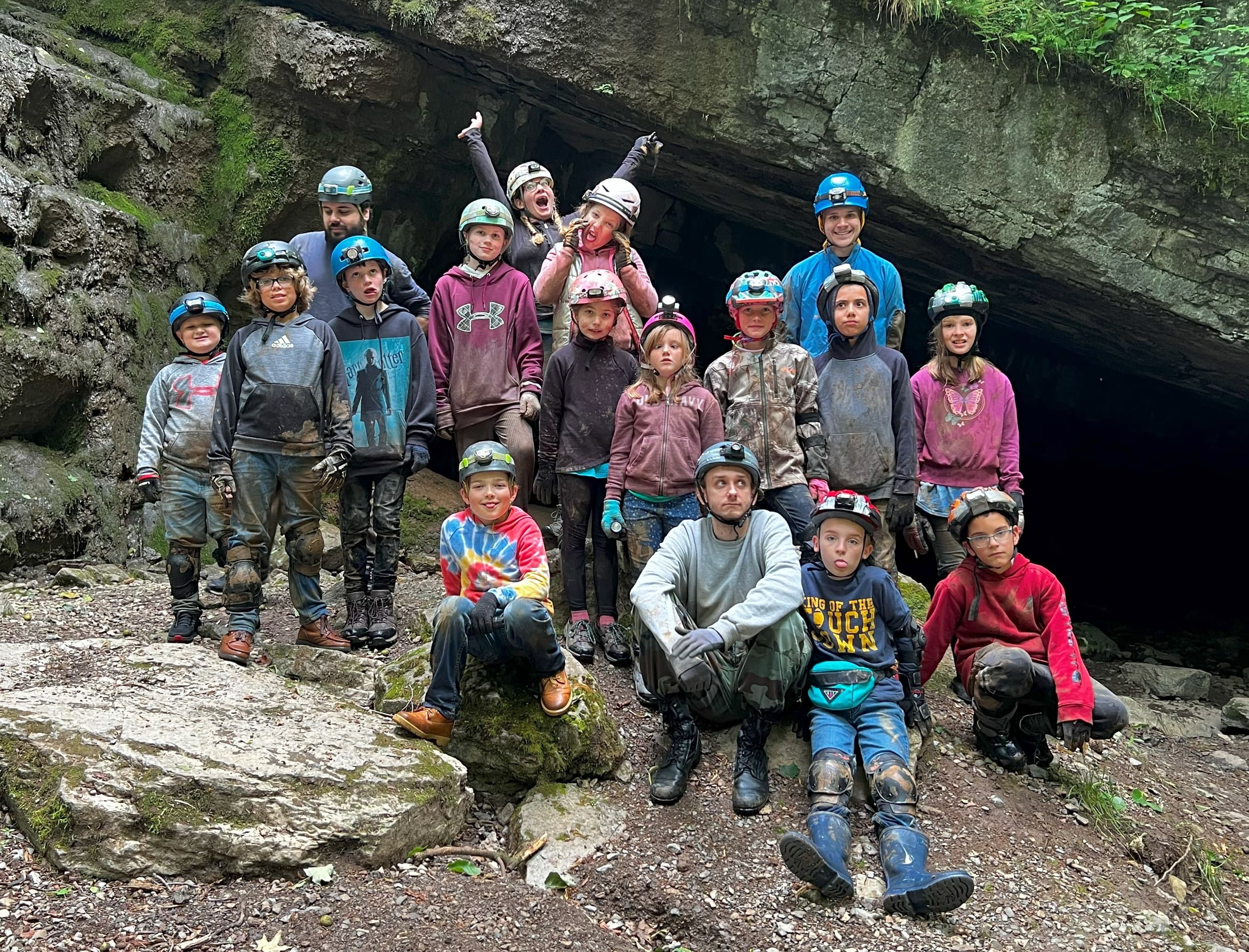 Caving group posing at cave entrance before spelunking at Lincoln Caverns