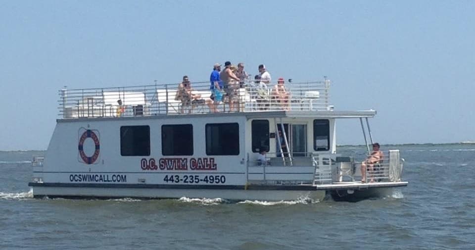 Side view of a charter tour boat cruising coastal waters