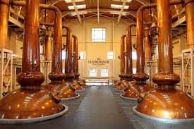 Traditional copper stillhouse interior tour showcasing whisky distillation