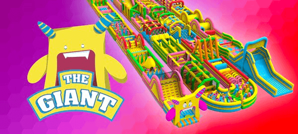 Giant inflatable obstacle course at colorful outdoor event