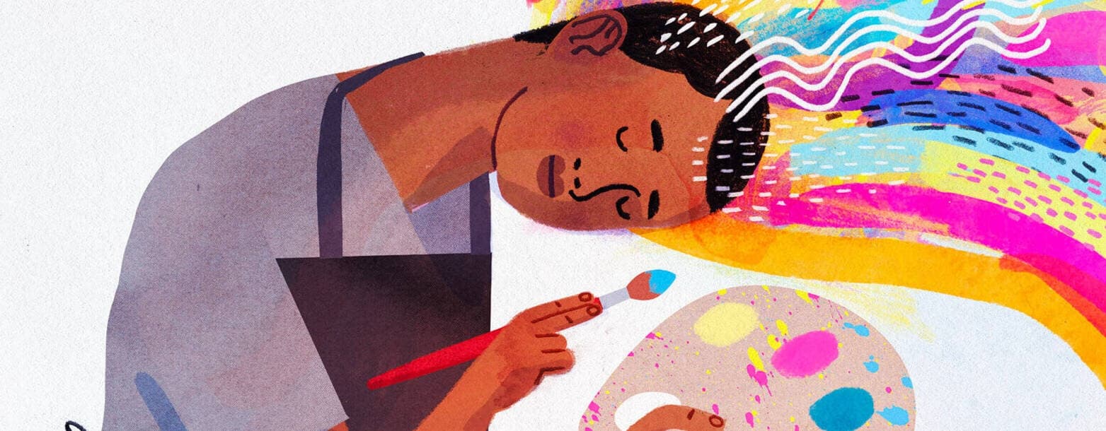 Artist painting rainbow illustration in indoor art studio