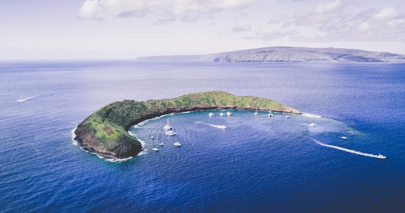 Aerial view of Maui islet and ocean shoreline, scenic seascape