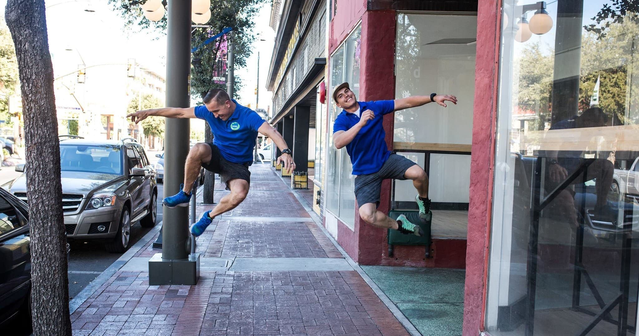 Enthusiastic guides jumping on Tucson street during city food tour