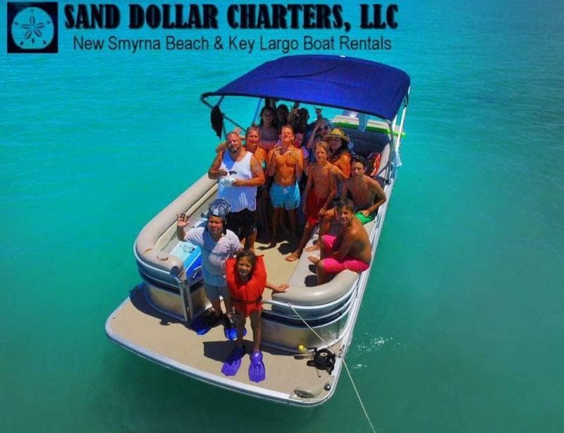 Aerial view of crowded charter boat on turquoise Key Largo sea